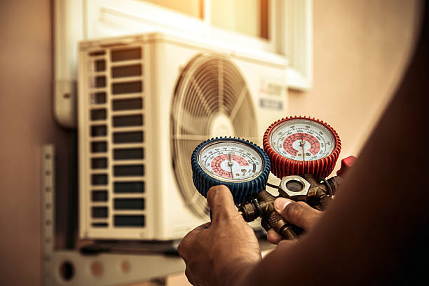 Professional Heat Pump Repair technician working in Live Oak, TX